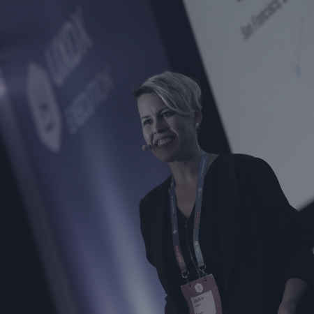 Woman on stage presenting